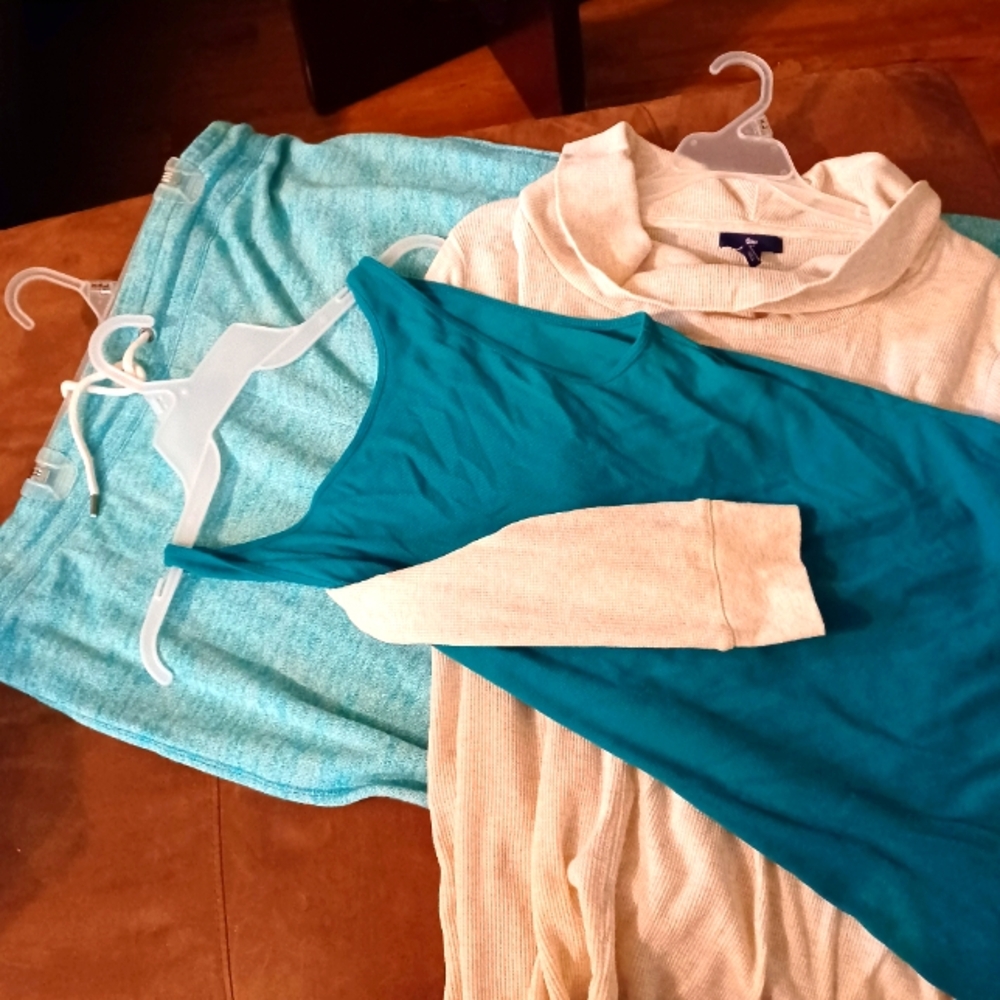 Selling sweat pants, tank top, and thermal like top as a set.